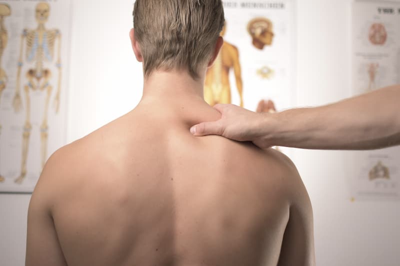 The back of a man's neck at a doctor's office